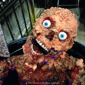 The "Tarman" Toxic Zen Fountain is a dripping corpse with acid eaten arms that are reaching out to you and eyes that stare into your soul.