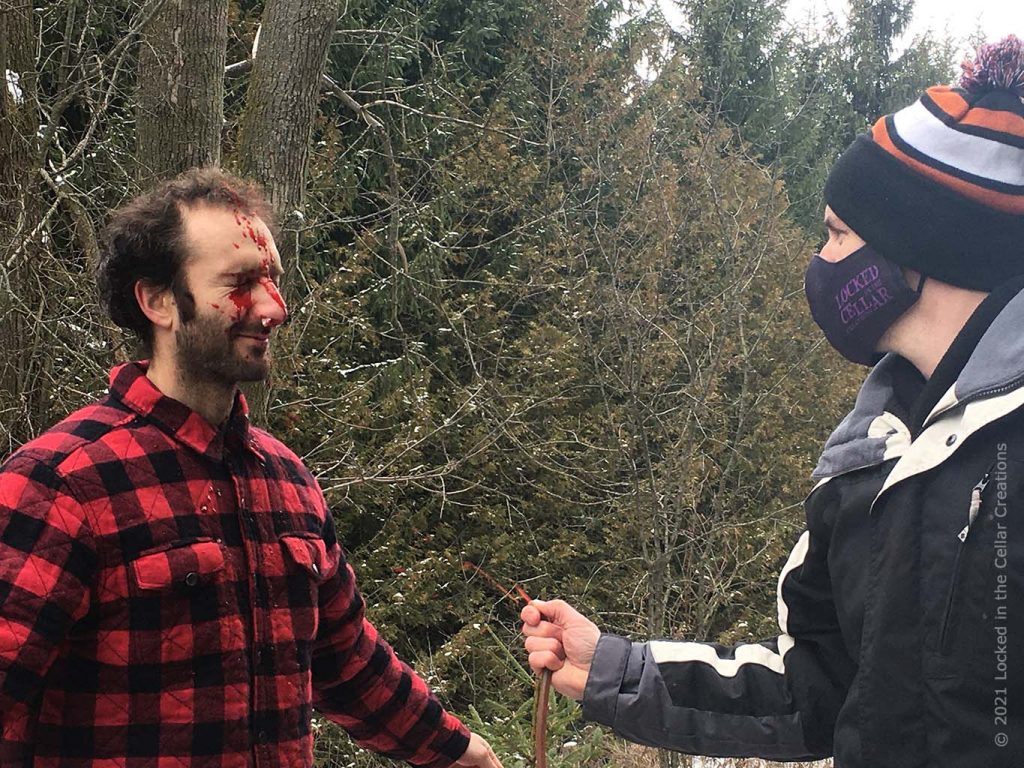 FX artist Brian sprays fake blood on actor Michael Masurkevitch