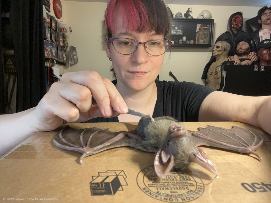 Desiree working on a realistic vampire bat puppet